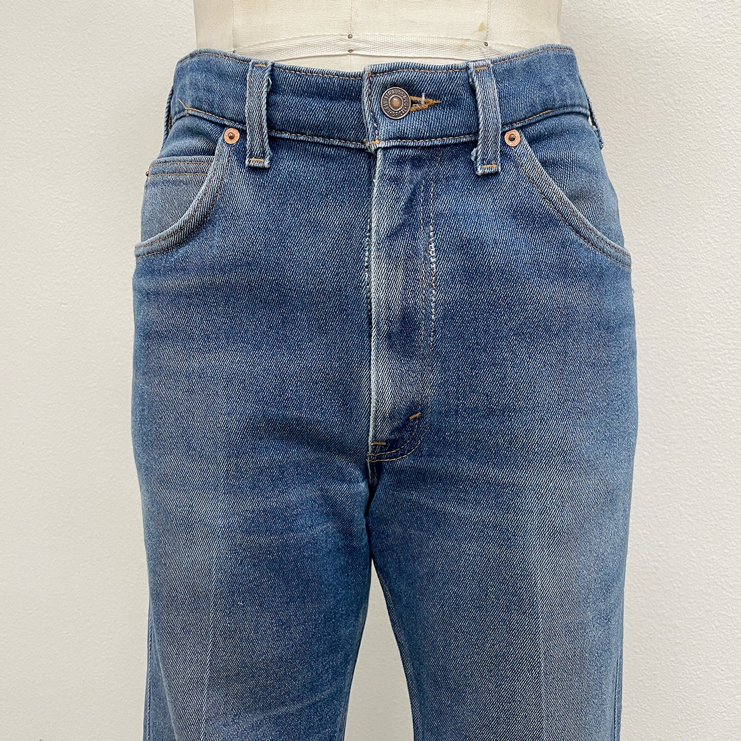 high rise Blue jeans on a white background