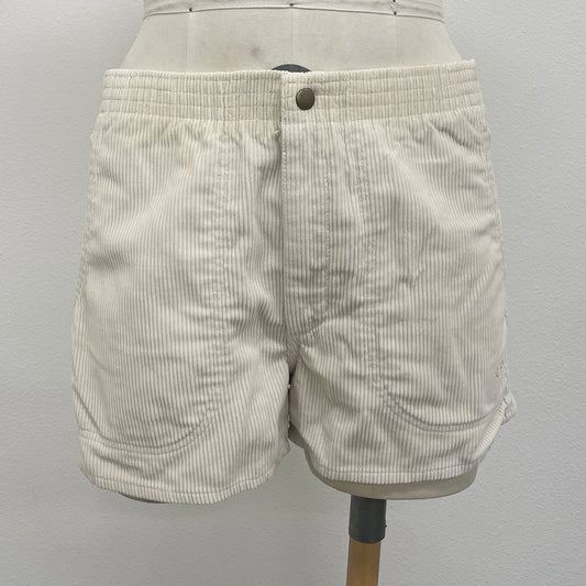 Natural cord shorts on a mannequin against a white background