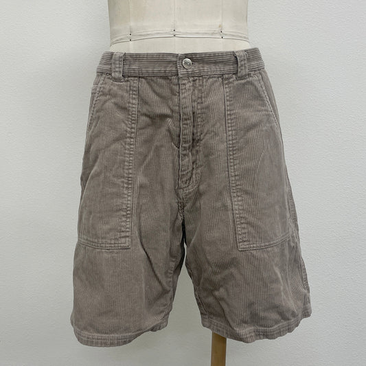 Brown shorts on a mannequin against a white background