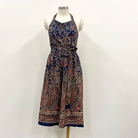 Patterned halter dress on a mannequin against a white background
