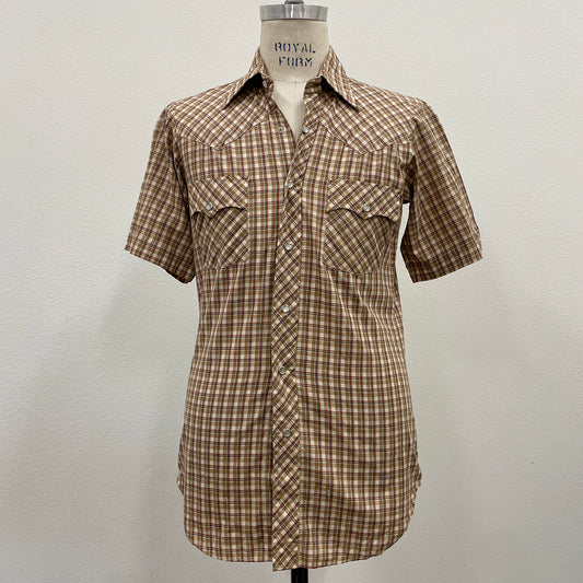 Khaki Plaid shirt on a mannequin against a plain background
