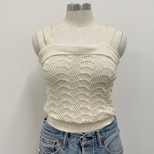 White crochet knitted tank top on a mannequin 